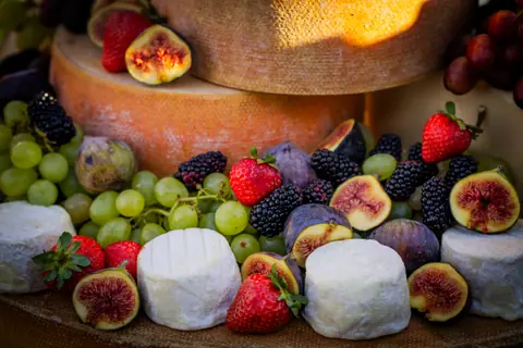 Cheese wheels, figs, strawberries and grapes on the grazing display at the ElevateOS Montreal networking event