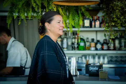 Guest talking near the rooftop bar