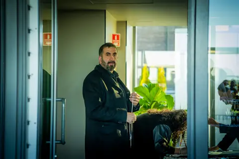 Guest arriving through the glass doors to the rooftop