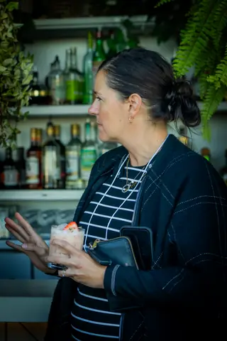 Attendee talking at the bar