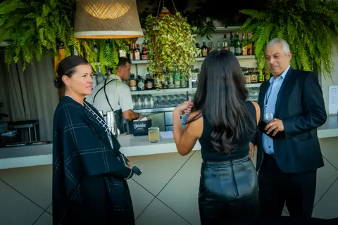 Guests ordering drinks at the rooftop bar