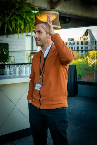 Attendee waving across the terrace