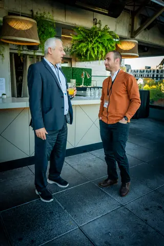 Two guests talking on the rooftop terrace