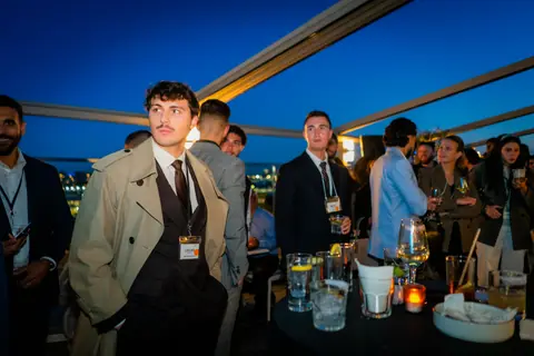 Attendees gathered on the rooftop to hear the panel after dark