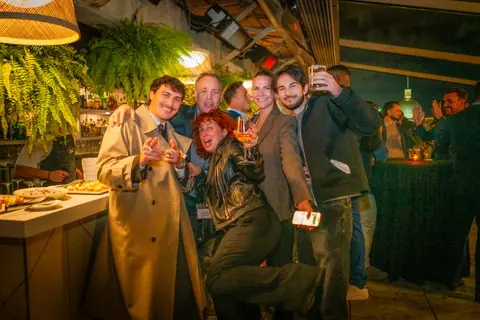 Group of attendees joking around for the camera near the end of the night