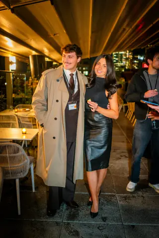 Two guests posing under the terrace heaters